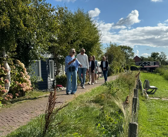 Maaike your local tourguide  wearing Dutch wooden shoes. Windmill, Tulips, Cheese, Zaanse Schans, Keukenhof, Volendam, Marken, Alkmaar.