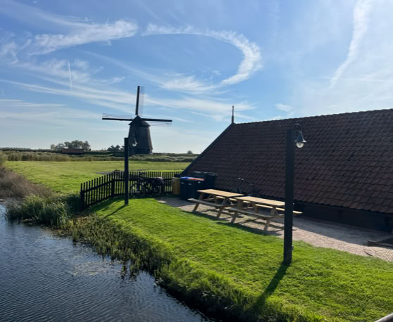 Maaike your local tourguide  wearing Dutch wooden shoes. Windmill, Tulips, Cheese, Zaanse Schans, Keukenhof, Volendam, Marken, Alkmaar.