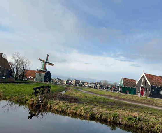 Maaike your local tourguide  wearing Dutch wooden shoes. Windmill, Tulips, Cheese, Zaanse Schans, Keukenhof, Volendam, Marken, Alkmaar.