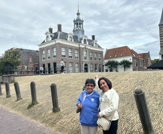 Maaike your local tourguide  wearing Dutch wooden shoes. Windmill, Tulips, Cheese, Zaanse Schans, Keukenhof, Volendam, Marken, Alkmaar.