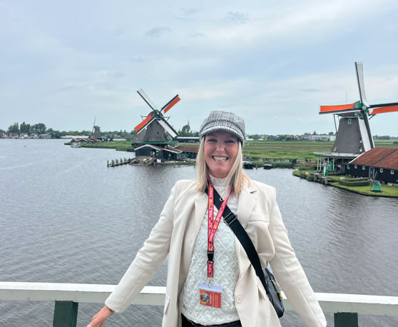 Maaike your local tourguide  wearing Dutch wooden shoes. Windmill, Tulips, Cheese, Zaanse Schans, Keukenhof, Volendam, Marken, Alkmaar.
