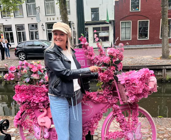 Maaike your local tourguide  wearing Dutch wooden shoes. Windmill, Tulips, Cheese, Zaanse Schans, Keukenhof, Volendam, Marken, Alkmaar.