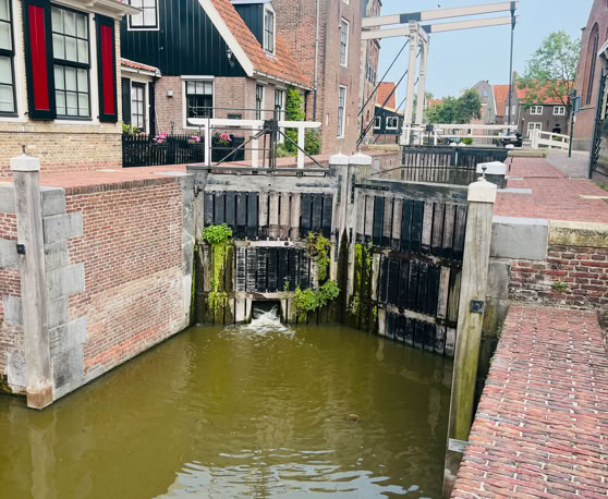 Maaike your local tourguide  wearing Dutch wooden shoes. Windmill, Tulips, Cheese, Zaanse Schans, Keukenhof, Volendam, Marken, Alkmaar.