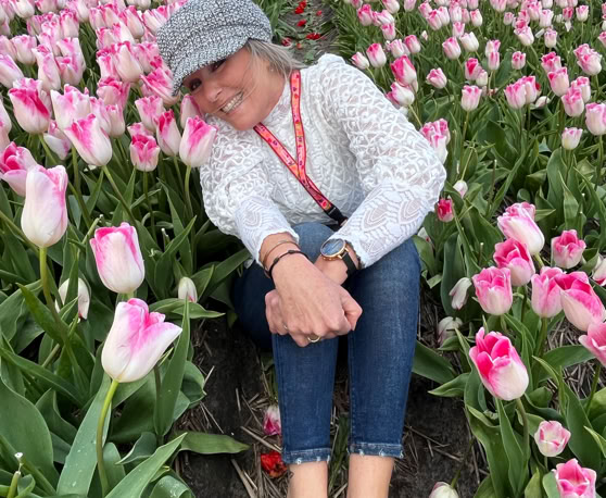 Maaike your local tourguide  wearing Dutch wooden shoes. Windmill, Tulips, Cheese, Zaanse Schans, Keukenhof, Volendam, Marken, Alkmaar.
