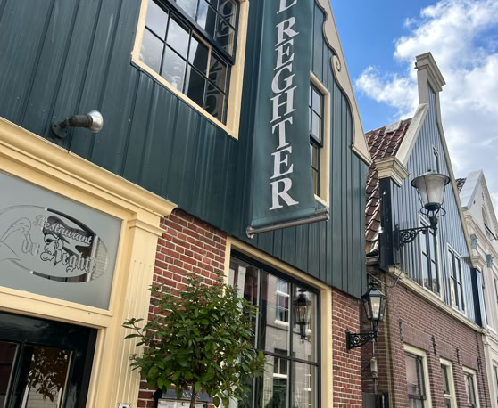 Maaike your local tourguide  wearing Dutch wooden shoes. Windmill, Tulips, Cheese, Zaanse Schans, Keukenhof, Volendam, Marken, Alkmaar.