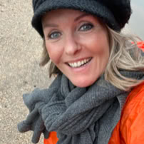 Maaike your local tourguide  wearing Dutch wooden shoes. Windmill, Tulips, Cheese, Zaanse Schans, Keukenhof, Volendam, Marken, Alkmaar.