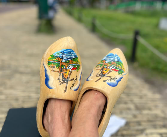 Maaike your local tourguide  wearing Dutch wooden shoes. Windmill, Tulips, Cheese, Zaanse Schans, Keukenhof, Volendam, Marken, Alkmaar.