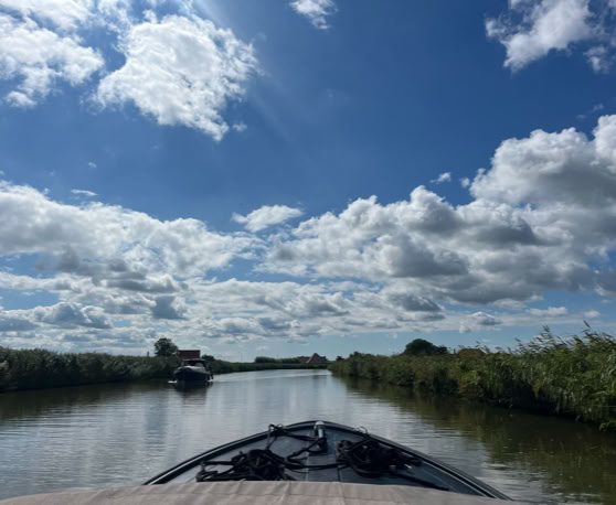 Maaike your local tourguide  wearing Dutch wooden shoes. Windmill, Tulips, Cheese, Zaanse Schans, Keukenhof, Volendam, Marken, Alkmaar.