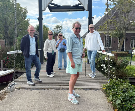 Maaike your local tourguide  wearing Dutch wooden shoes. Windmill, Tulips, Cheese, Zaanse Schans, Keukenhof, Volendam, Marken, Alkmaar.