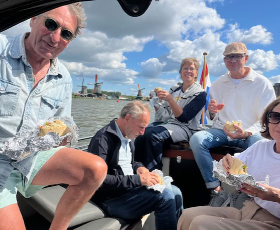 Maaike your local tourguide  wearing Dutch wooden shoes. Windmill, Tulips, Cheese, Zaanse Schans, Keukenhof, Volendam, Marken, Alkmaar.