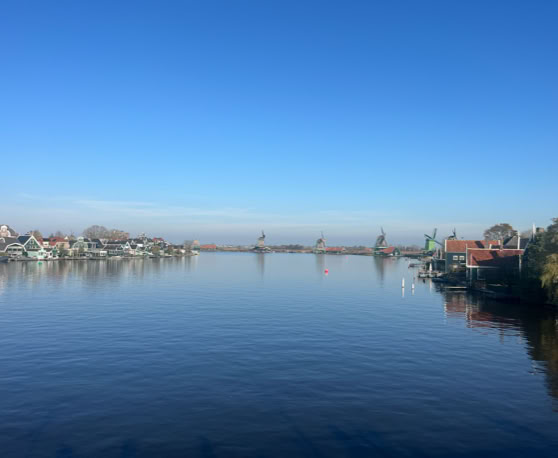Maaike your local tourguide  wearing Dutch wooden shoes. Windmill, Tulips, Cheese, Zaanse Schans, Keukenhof, Volendam, Marken, Alkmaar.