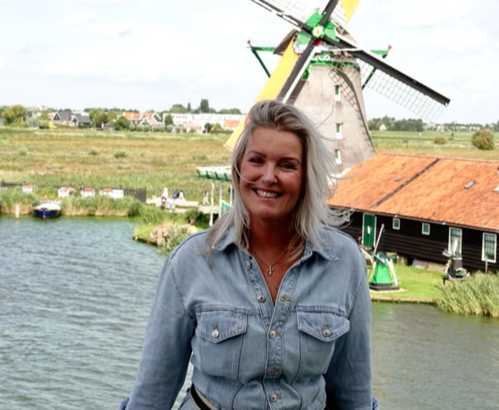Maaike your local tourguide  wearing Dutch wooden shoes. Windmill, Tulips, Cheese, Zaanse Schans, Keukenhof, Volendam, Marken, Alkmaar.