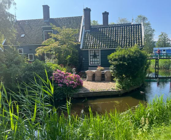 Maaike your local tourguide  wearing Dutch wooden shoes. Windmill, Tulips, Cheese, Zaanse Schans, Keukenhof, Volendam, Marken, Alkmaar.